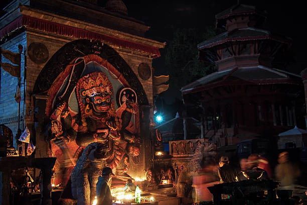 Statue of Kali, Kathmandu Durbar square Low light shot of a statue of Kali in the Durbar square of Kathmandu, the capital city of Nepal. kali statue stock pictures, royalty-free photos & images