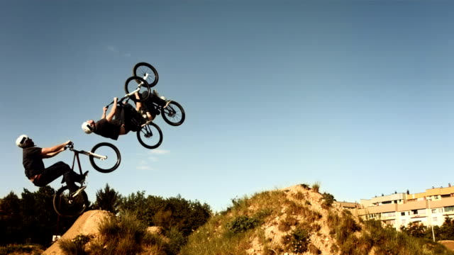 HD SLOW MOTION: Composite Shot Of A Backflipping Dirt Jump