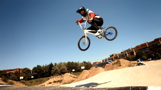 HD Super Slow-Mo: Bmx Riders Jumping Over Double Jump