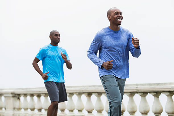 istock Two African American men running outdoors 473032088