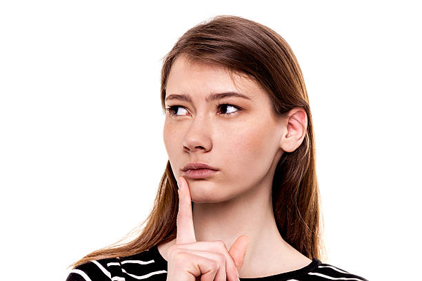 istock Young woman thinking hand on chin isolated 473034862
