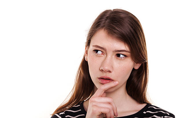 istock Young woman thinking hand on chin isolated Stock Image 473034876