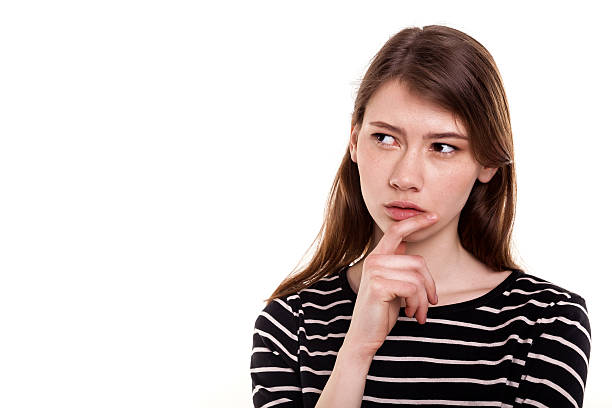 istock Young woman thinking hand on chin isolated Stock Image 473034878