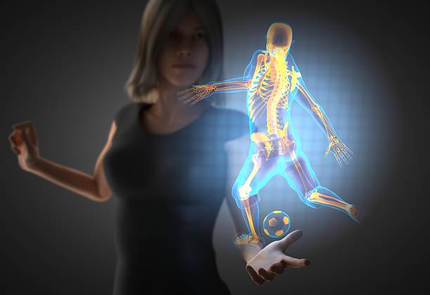istock woman and hologram with soccer 473040118