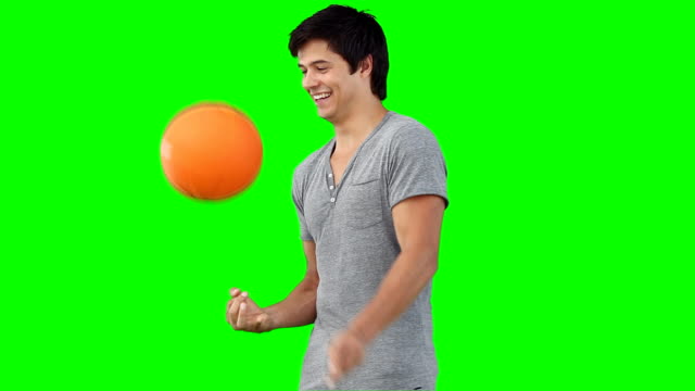 man spinning a basketball on his hand