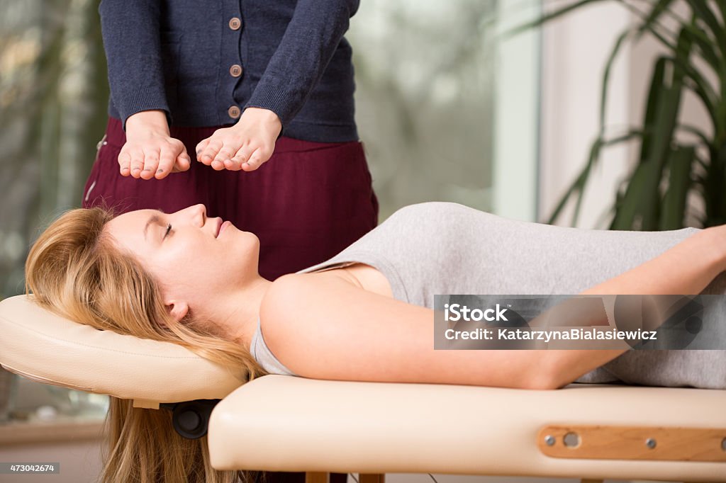 Bioenergy therapy session Young woman relaxing during bioenergy therapy session Biofuel Stock Photo