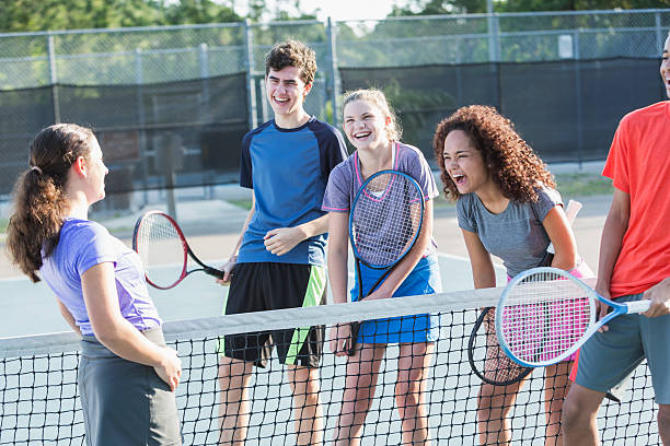 istock Teenagers playing tennis 473042952