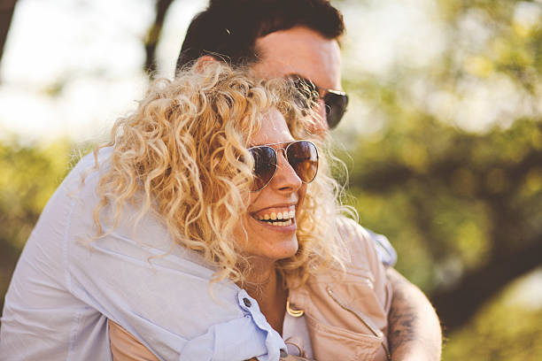 istock young couple in the park 473043004