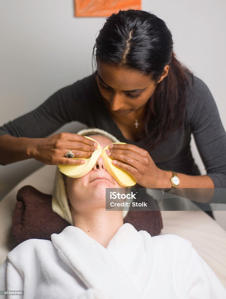 Eye treatment A blonde woman having a mask treatment in a beauty shop 2015 Stock Photo