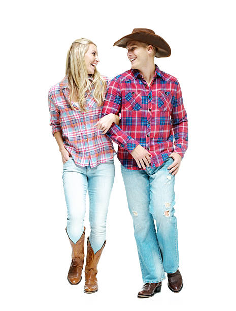 istock Smiling cowboy couple walking 473043304