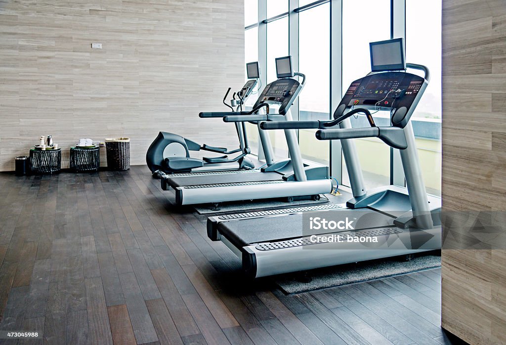 Empty gym room Empty gym room with group of exercise machine. Treadmill Stock Photo