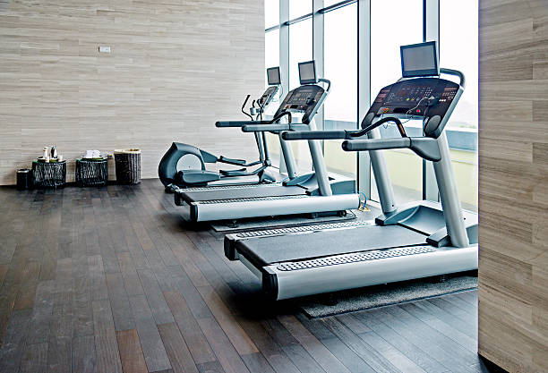 Empty gym room Empty gym room with group of exercise machine. training equipment stock pictures, royalty-free photos & images