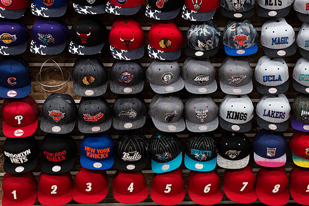 Wall full of team sport caps stock photo