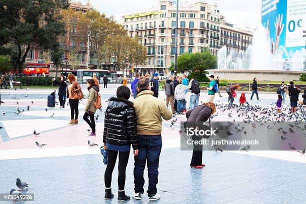 Asian Tourist Couple On Placa De Catalunya Stock Photo - Download Image Now - 2015, Adult, Architecture