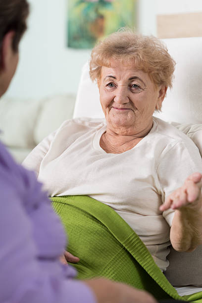 istock Old woman in bed 473054146