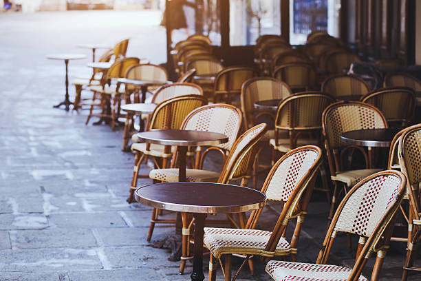 istock sidewalk cafe in Paris with open terrace 473054714