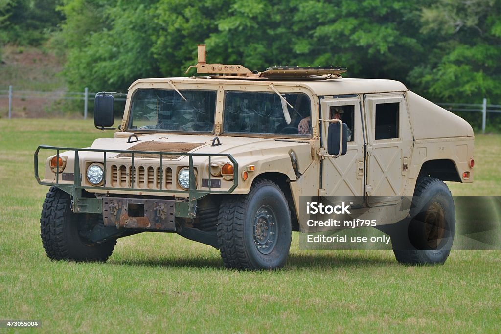 Military HMMWV Vehicle Crestview, USA - May 10, 2014: A beige Humvee/Hummer/HMMWV truck used by the U.S. Army for troop transport.  Humvee Stock Photo