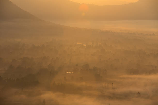 istock fog and cloud mountain valley sunrise landscape 473057450