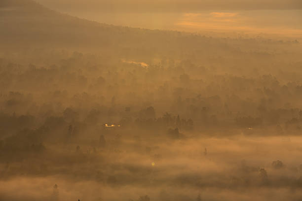 istock fog and cloud mountain valley sunrise landscape 473057452