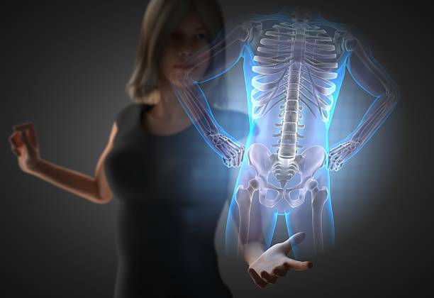 istock woman and hologram with bones radiography 473057932