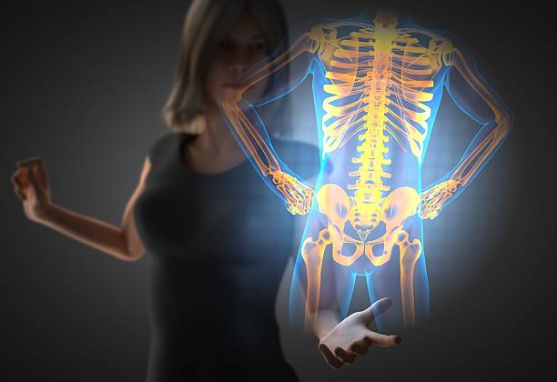 istock woman and hologram with bones radiography 473057934