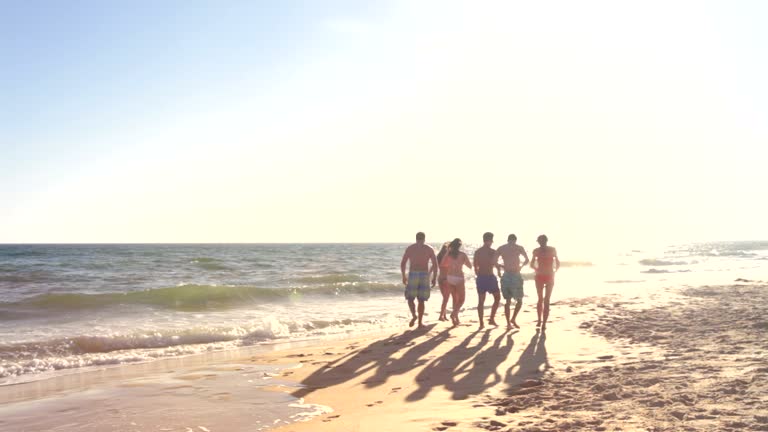 Group Of Teenage Friends Enjoying Beach Holiday Together