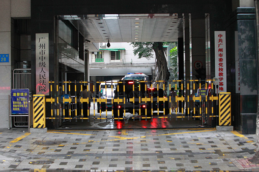 Guangzhou, Сhina - May 7, 2015: Police guard court entrance in Guangzhou, Guangdong province, China, May 7, 2015. An Australian man Peter Gardner on Thursday faced a possible death sentence on charges of attempting to smuggle millions of dollars worth of drugs out of China. Chinese authorities arrested New Zealand-born Peter Gardner, 26, at the international airport in the southern city of Guangzhou last November, carrying bags of nearly 30 kg (66 lb) of methamphetamine, known as \