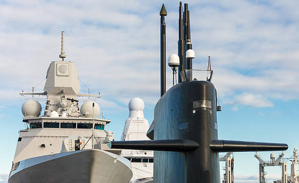 istock Naval fleet. Submarine and warships with guns. 473063680