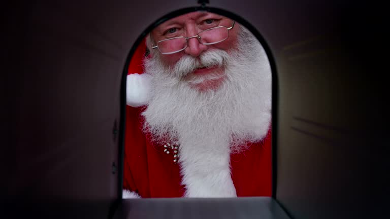 Santa Claus opens mailbox and gets letter