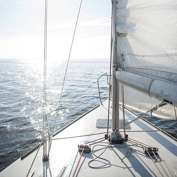 istock Yacht sailing towards the sunset 473071048