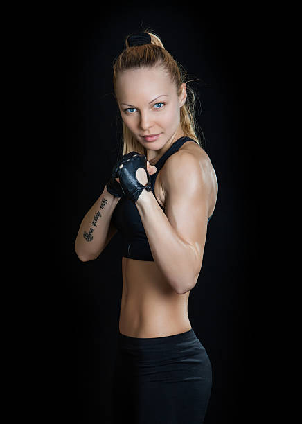 istock Athletic young woman with tattoo 473075032