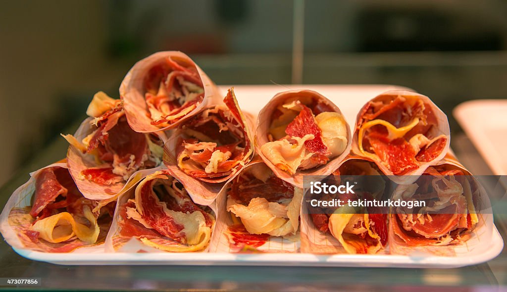 sliced bacons in cone at boqueria market of barcelona spain sliced bacons in cone for sale at famous boqueria market of barcelona spain 2015 Stock Photo