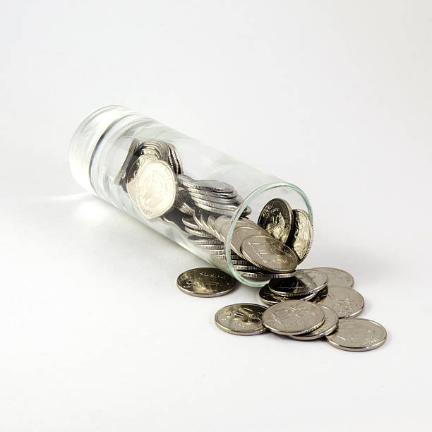 istock Ruble coins in a shot glass 473078322