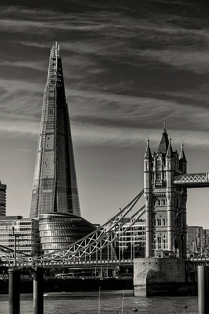London landmarks: The Shard, Tower Bridge and City Hall View of London's skyline with The Shard, Tower Bridge and City Hall. B/W effect. bankside photos stock pictures, royalty-free photos & images