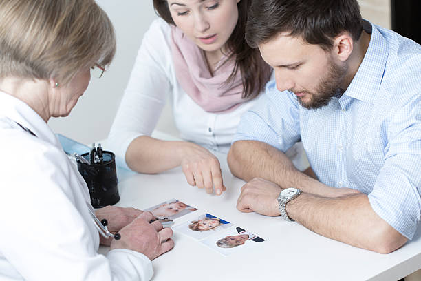 istock Couple choosing characteristic of their child 473081908