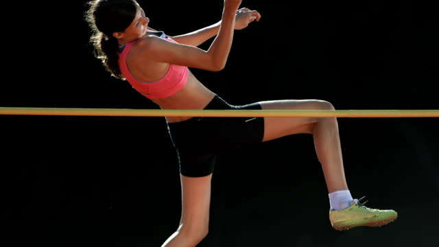 HD Super Slow-Mo: Young Woman Training A High Jump