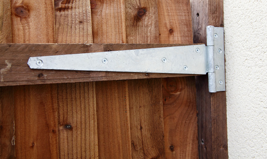 close up of a single galvernised gate hinge