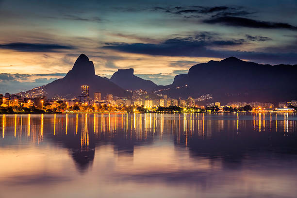 istock Sunset behind mountains in Rio de Janeiro with water reflection 473089824