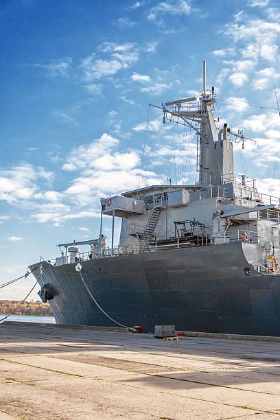 istock Naval auxiliary ship docked at the harbor. 473093002