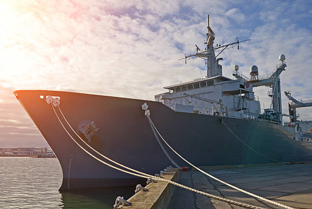 istock Naval auxiliary ship docked at the harbor. 473093168