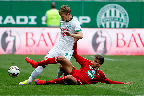 Ferencvaros vs. DVSC football match Budapest, Hungary - May 10, 2015: Michal Nalepa of Ferencvaros (l) is tackled by Norbert Balogh of DVSC during Ferencvaros vs. DVSC OTP Bank League football match in Groupama Arena. foul stock pictures, royalty-free photos & images