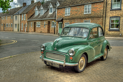 Eky, United Kingdom - August 18, 2014: Green Morris Mini Minor 1000 saloon. This is created from 3 bracketed images combined in HDR software and adjusted to give a natural look in Photoshop. The car was situated in Ely, Cambridgeshire. 