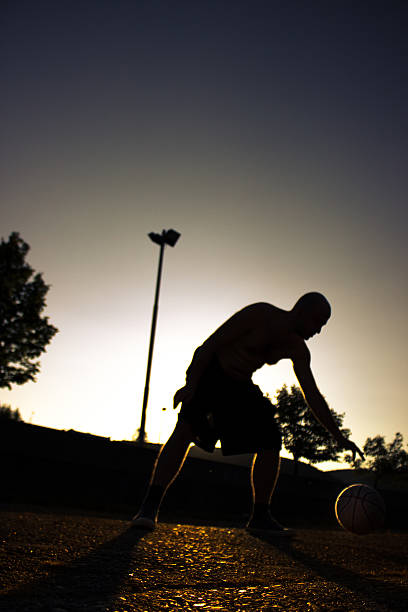 istock Street basketball at sunset 473097312