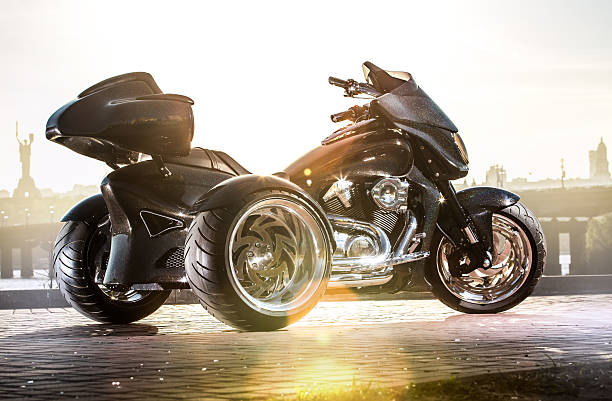istock Black trike standing on the light street 473100302