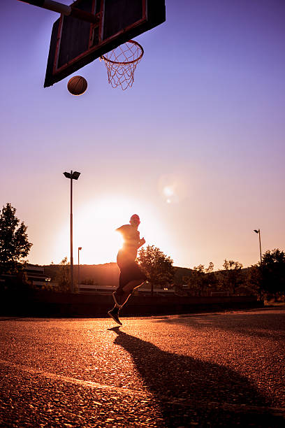 istock Street basketball at sunset 473100766