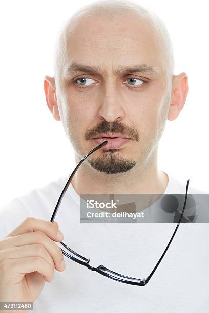 Closeup Of A Young Man Thinking With Worried Expression Stock Photo - Download Image Now