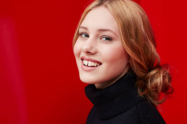 istock Beautiful woman on red 473115056