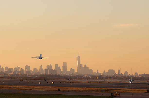 Airplane Take Off from JFK Airport with New York City Skyline