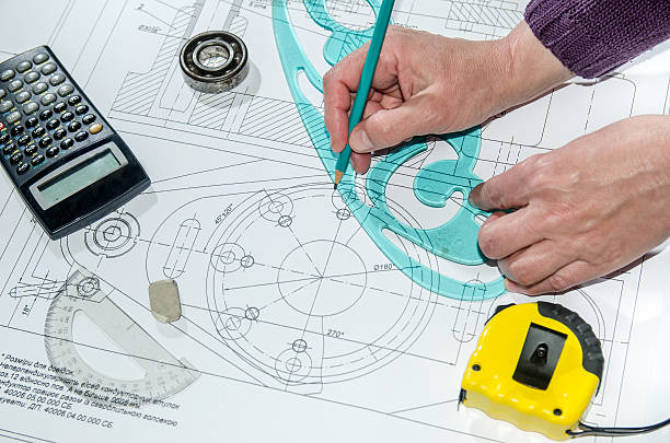 istock engineering drawings with hands drawing  project by pencil on paper 473118378