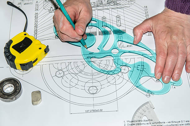 istock engineering drawings with hands drawing  project by pencil on paper 473118382